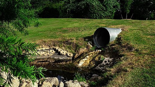 picture of sewage pipe into a waterway