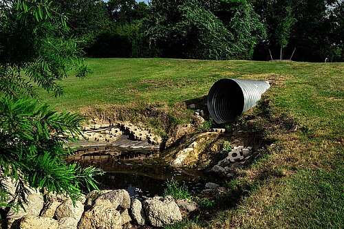 picture of sewage pipe into a waterway